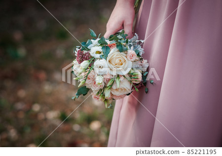 Bouquet of flowers in the hand of the bride Bouquet of flowers in the hand of the bride 85221195