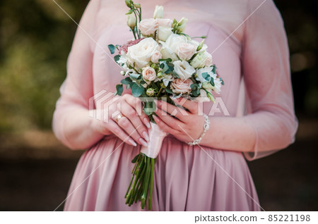 Bouquet of flowers in the hand of the bride Bouquet of flowers in the hand of the bride 85221198