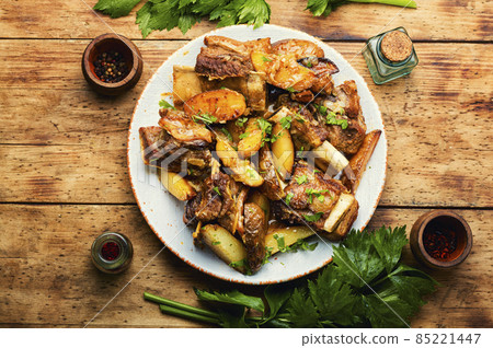 Beef stew with potatoes, wooden background 85221447