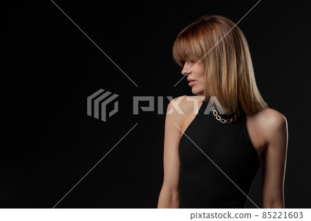 blonde woman with short hair on black background blonde woman with short hair on black background 85221603