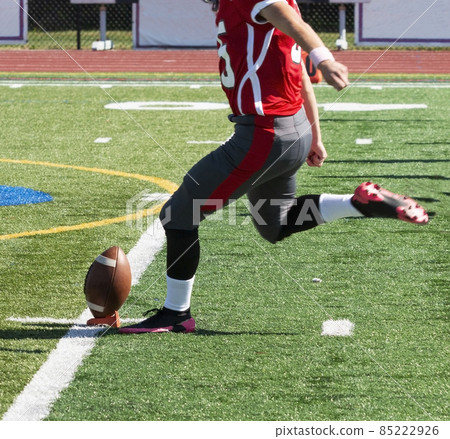 Football kicker kicking off during a game 85222926