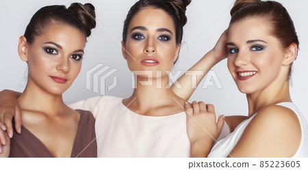 tree pretty stylish young woman with same hairstyle and makeup, best friend together having fun, lifestyle people concept 85223605