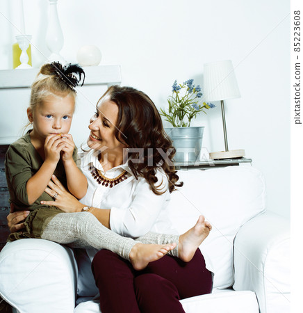 happy smiling mother with little cute daughter at home interior, casual look modern real family, lifestyle people concept 85223608