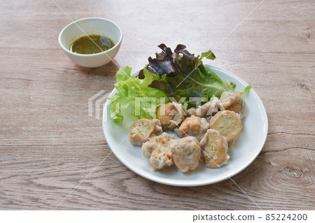 steamed Hakka meatball made from chop pork stuffing fried tofu with fresh vegetable on plate dipping spicy chili sauce steamed Hakka meatball made from chop pork stuffing fried tofu with fresh vegetable on plate dipping spicy chili sauce 85224200