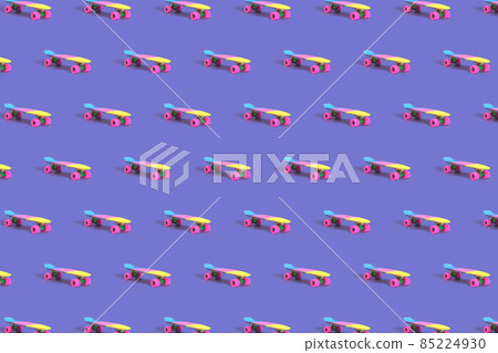 Pattern made of rainbow plastic skateboard on purple background Pattern made of rainbow plastic skateboard on purple background 85224930