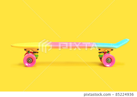 rainbow plastic Penny board skateboard isolated on yellow background rainbow plastic Penny board skateboard isolated on yellow background 85224936