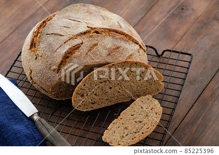 Freshly baked homemade artisan sourdough rye and white flour bread. Sliced. Copy space. Freshly baked homemade artisan sourdough rye and white flour bread. Sliced. Copy space. 85225396