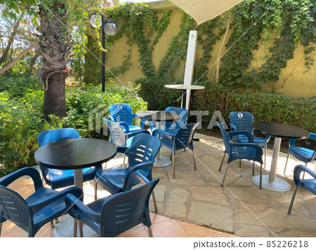 Table and chairs in a street cafe on the shore near the sea in Batumi, Georgia Table and chairs in a street cafe on the shore near the sea in Batumi, Georgia 85226218