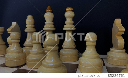 Handmade wooden chess set varnished on a wooden board for playing 85226761