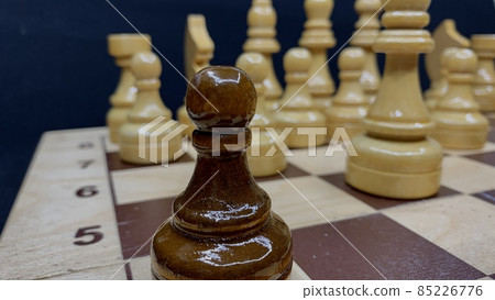 Handmade wooden chess set varnished on a wooden board for playing 85226776