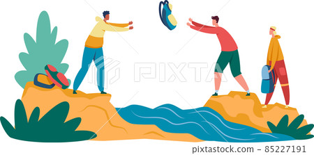 Group of tourists crossin river on hike 85227191