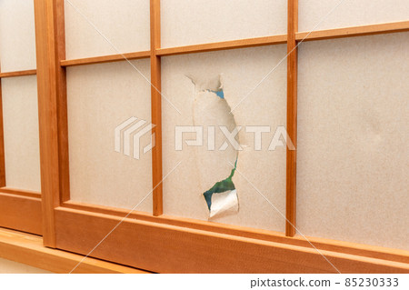 A shoji that was severely torn A shoji that was severely torn 85230333