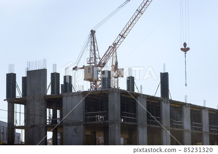 Residential lots building of tower construction work site with cranes with blue sky Residential lots building of tower construction work site with cranes with blue sky 85231320