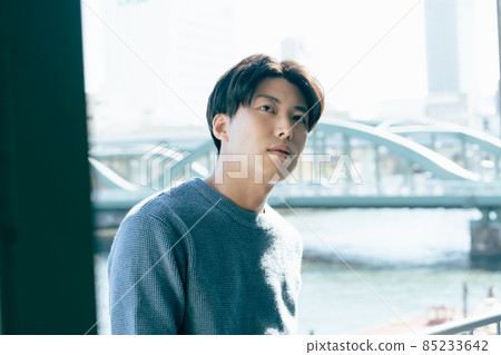 Young man relaxing by the window 85233642