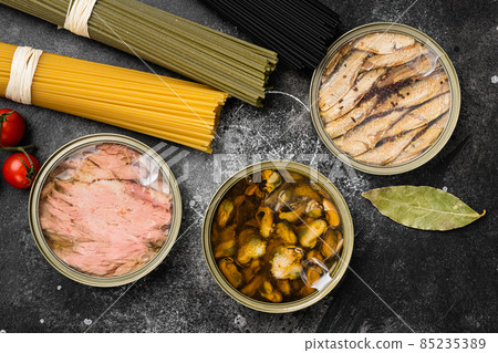 Seafood canned fish mussels food, on black dark stone table background, top view flat lay 85235389