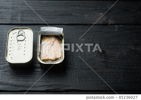Canned Wild Pink Salmon, in tin can, on black wooden table background, with copyspace and space for text Canned Wild Pink Salmon, in tin can, on black wooden table background, with copyspace and space for text 85236027
