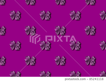 A bow for decorating gifts, painted in purple Velvet Violet. Beautifully tied bow. Photo of a gift package with a seamless pattern. A bow for decorating gifts, painted in purple Velvet Violet. Beautifully tied bow. Photo of a gift package with a seamless pattern. 85241118