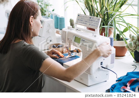 Support local business, small business. Run Own Sewing startup. Start full time business, make extra money with sewing side hustle. Woman owner of sewing business in home studio Support local business, small business. Run Own Sewing startup. Start full time business, make extra money with sewing side hustle. Woman owner of sewing business in home studio 85241824