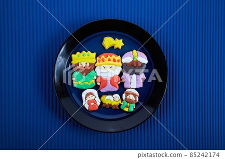 Happy Epiiphany day. Homemade cookies in the shape of the three wise men and Holy family. 85242174