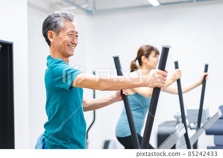 Active seniors exercising in the gym Active seniors exercising in the gym 85242433