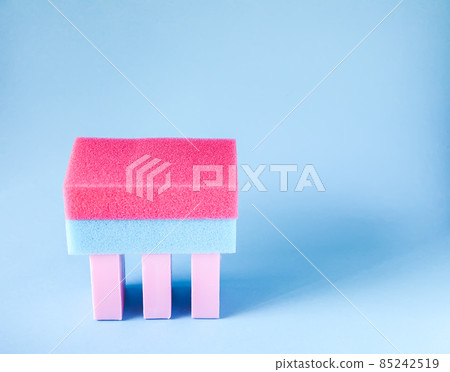 Colorful washcloths and bars of soap on a blue background. Accessories for body care and hygiene. Colorful washcloths and bars of soap on a blue background. Accessories for body care and hygiene. 85242519