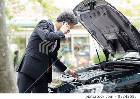 Businessman car breakdown road service Businessman car breakdown road service 85242685
