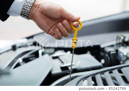 Businessman car trouble engine oil 85242799
