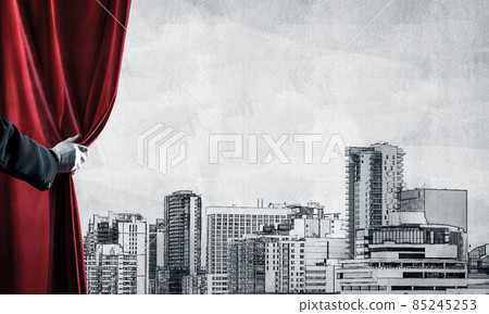 Modern drawn cityscape behind drapery curtain and hand opening it Modern drawn cityscape behind drapery curtain and hand opening it 85245253