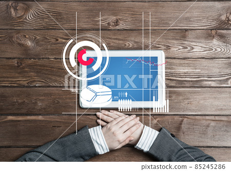 Business workplace with tablet device and media graphs and diagrams Business workplace with tablet device and media graphs and diagrams 85245286