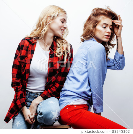best friends teenage girls together having fun, posing emotional on white background, besties happy smiling, lifestyle people concept close up. making selfie 85245302