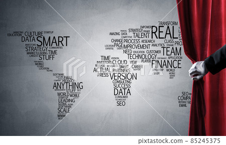 World map behind drapery curtain and hand opening it World map behind drapery curtain and hand opening it 85245375