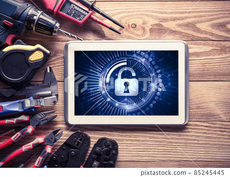 Web security and technology concept with tablet pc on wooden table Web security and technology concept with tablet pc on wooden table 85245445