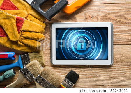 Web security and technology concept with tablet pc on wooden table Web security and technology concept with tablet pc on wooden table 85245491
