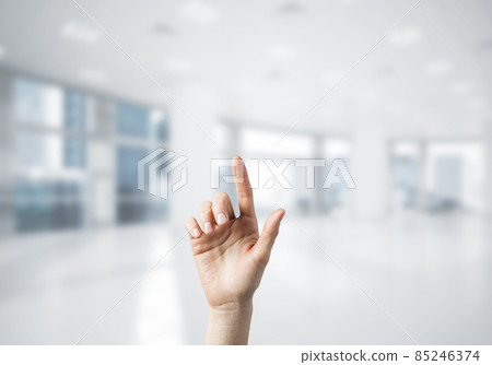 Choosing gesture of person in elegant modern interior in sunshine light 85246374
