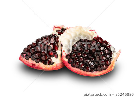 Pieces of dark red pomegranate fruit isolated on white background. Pieces of dark red pomegranate fruit isolated on white background. 85246886