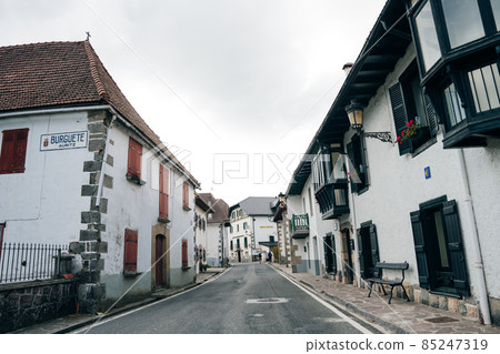 village Espinal, SPAIN- Nov 2020: Street in village of company town , colonia guell. village Espinal, SPAIN- Nov 2020: Street in village of company town , colonia guell. 85247319