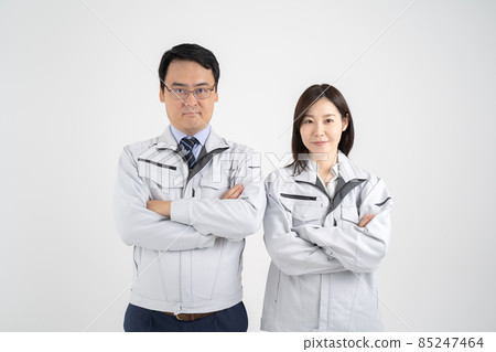 White background of a businessman wearing work clothes for men and women with arms folded White background of a businessman wearing work clothes for men and women with arms folded 85247464