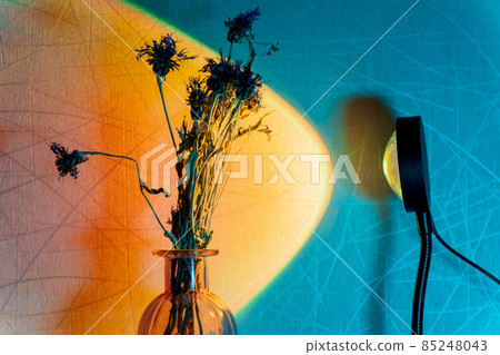 Sunset projector lamp on the table. Multi colored RGB light. Home decor. Sunset projector lamp on the table. Multi colored RGB light. Home decor. 85248043