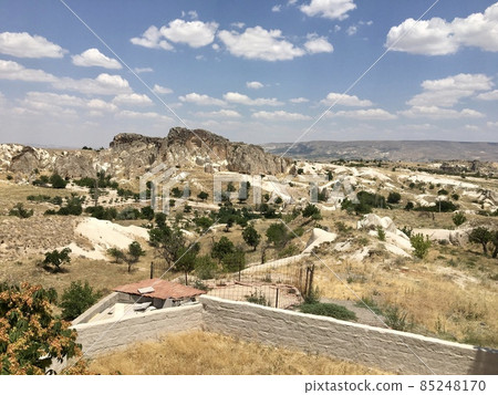 Cappadocia is not only hot air balloons, but also beautiful landscapes of houses in rocks and greenery. Cappadocia, magic music frozen in stone. 85248170