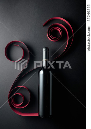 Bottle of red wine on a black background. Bottle of red wine on a black background. 85249263