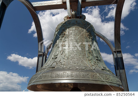 Orthodox bells closeup against the sky with clouds.  New Jerusalem in town Istra, surroundings of Moscow, Russia. 85250564