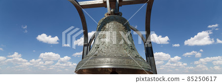 Orthodox bells closeup against the sky with clouds.  New Jerusalem in town Istra, surroundings of Moscow, Russia. 85250617