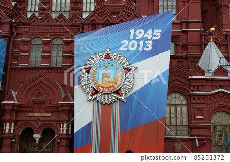 Victory Day decoration, Moscow, Russia. Banners with medals and ribbons on the facade of Historical museum 85251372