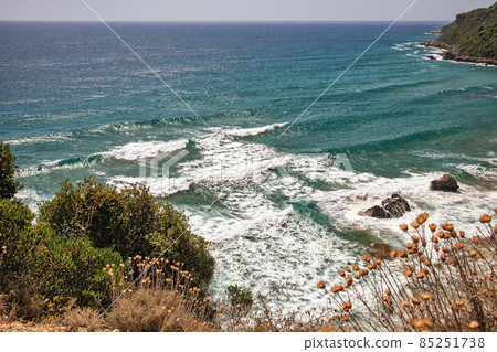 Sea waves crashing onto rocks with water splashes. Corfu, Greece. 85251738
