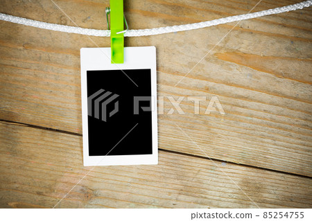 blank photos on wooden background 85254755