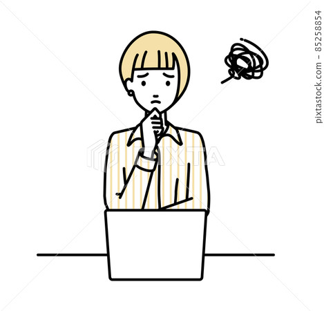 A woman in a blouse sitting at a desk and opening her PC A woman in a blouse sitting at a desk and opening her PC 85258854
