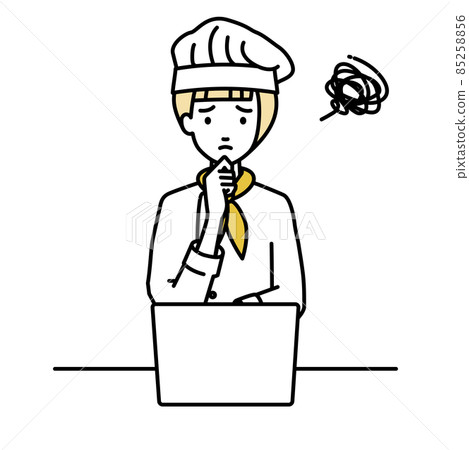 A cook woman sitting at a desk and opening her PC A cook woman sitting at a desk and opening her PC 85258856