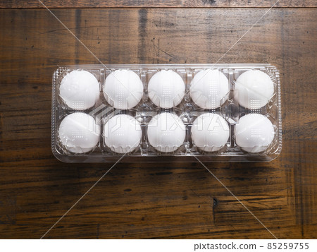 White eggs in a plastic pack 85259755