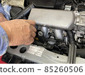 Car mechanic Hands during oil change work 85260506