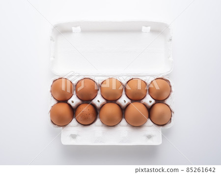 Red eggs in a paper pack 85261642